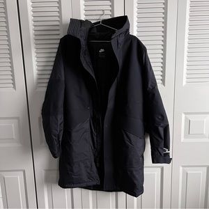 NIKE SPORTSWEAR STORM-FIT ADV MEN'S SHELL WINDSTORMS JACKET BLACK.